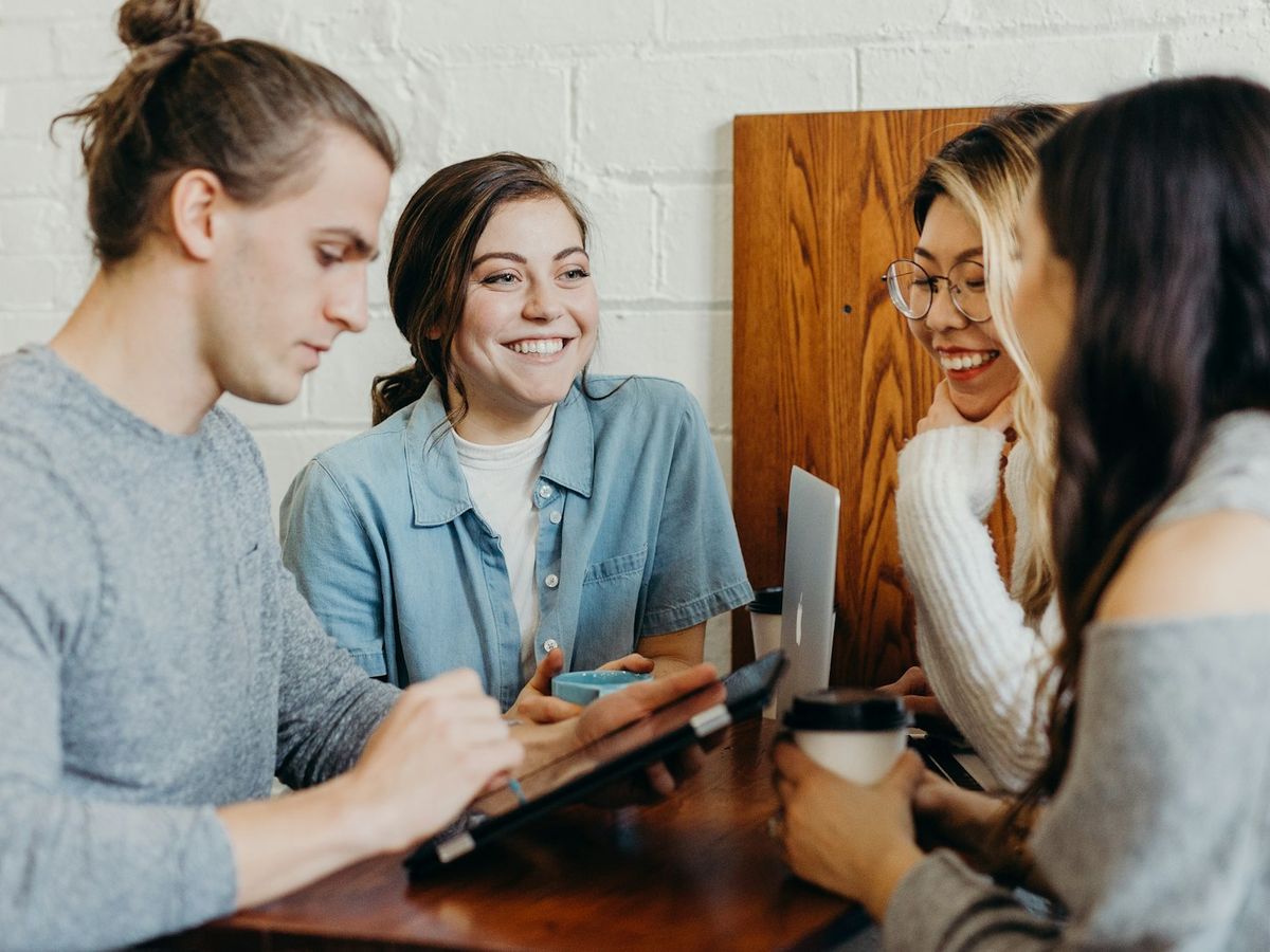 Three students studying together at a table